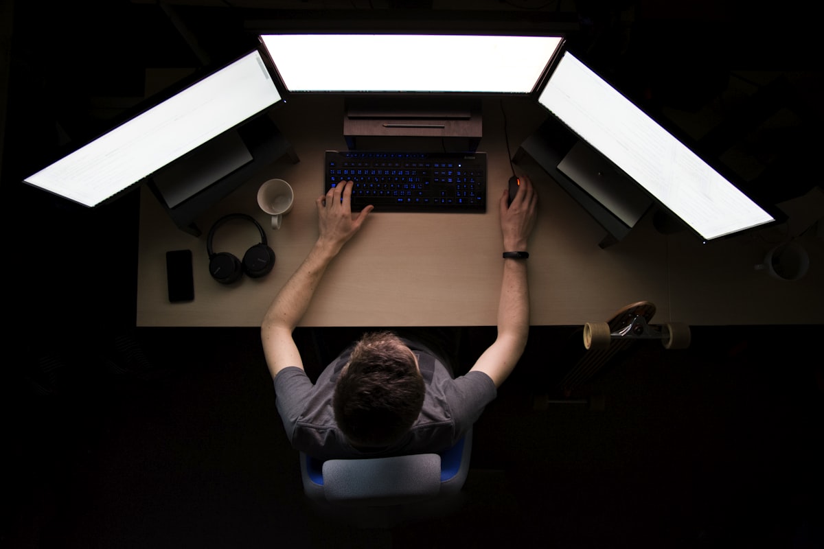A developer working across multiple screens late at night — the reality of staying on top of AI