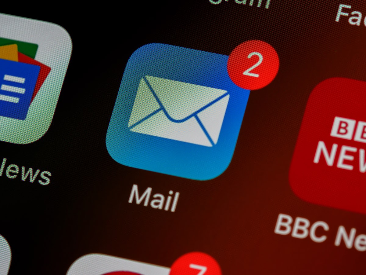 Email inbox notification on a smartphone — the daily ritual of newsletter readers